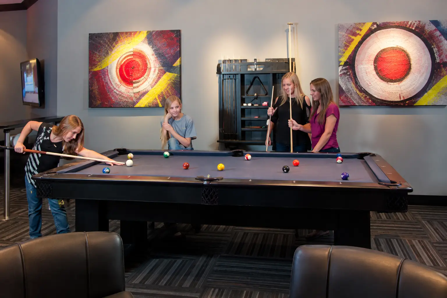 Members playing pool in the Patriot Gun Club lounge